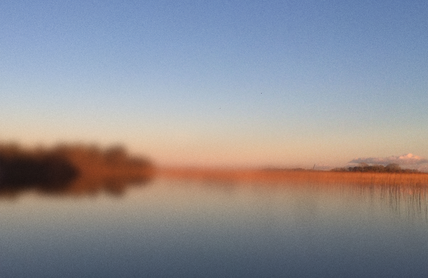 A quiet sky at dusk settling over the land.